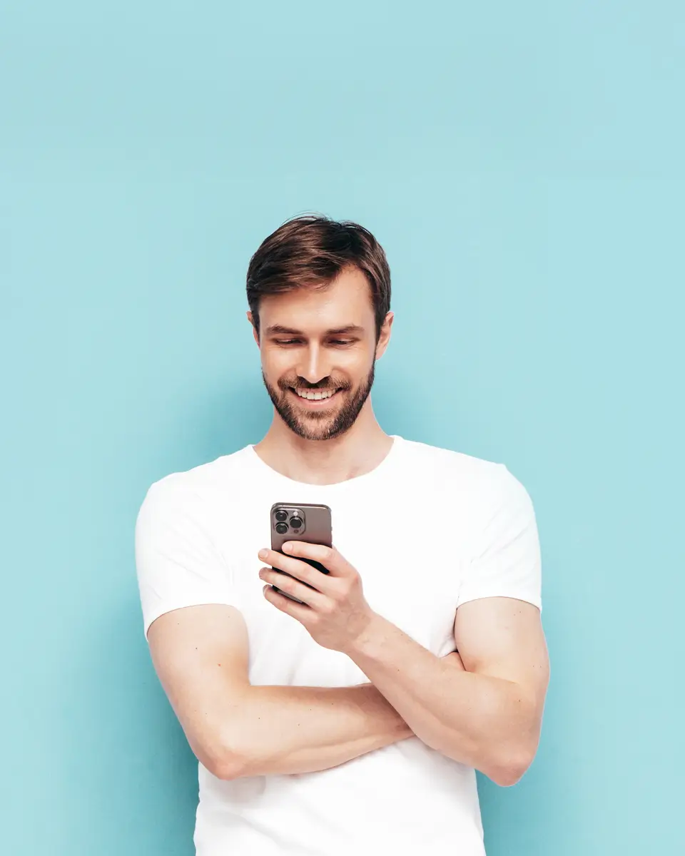 Man on his phone smiling